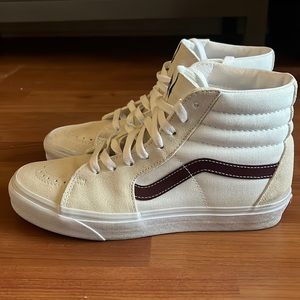 Cream / dark red or brown high top Vans